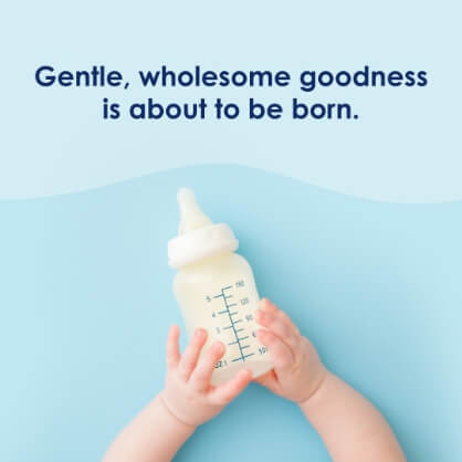 instagram post. Image of baby hands holding a bottle and text, "Gentle, wholesome goodness is about to be born."