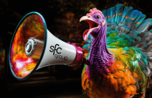 a colorful turkey screams into a loudspeaker