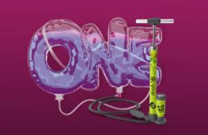 pump connected balloon with purple liquid in the shape of the word "one"